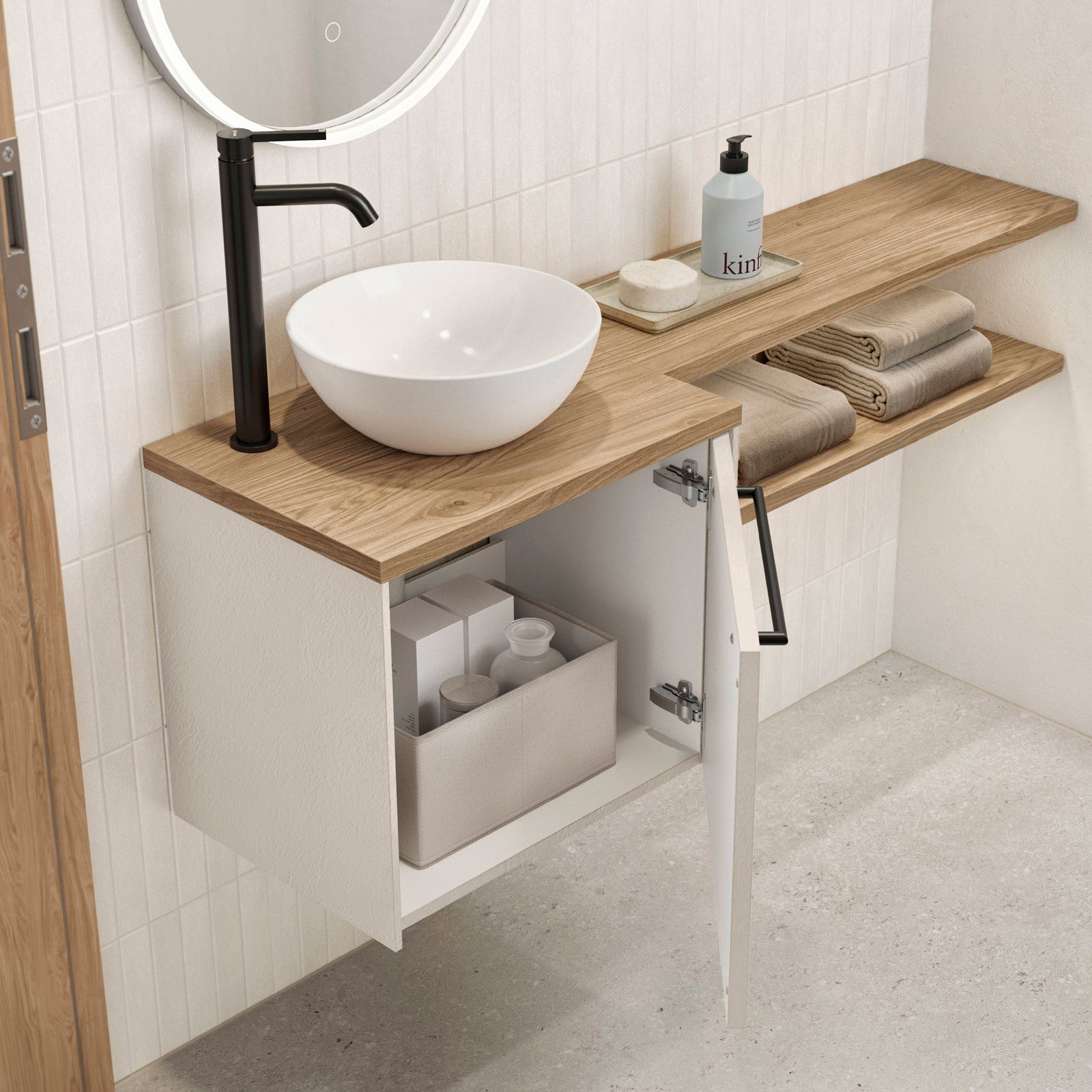 Weißer aufgesetzter Waschtisch im Gästebad mit schwarzer Armatur